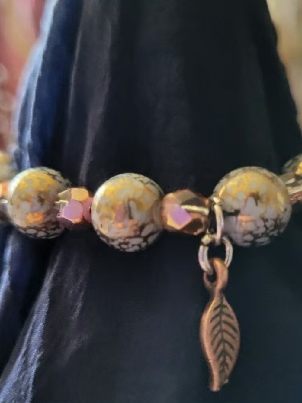 Stunning Gold Green Bead Wrist Wrap with Brass Leaf Charm